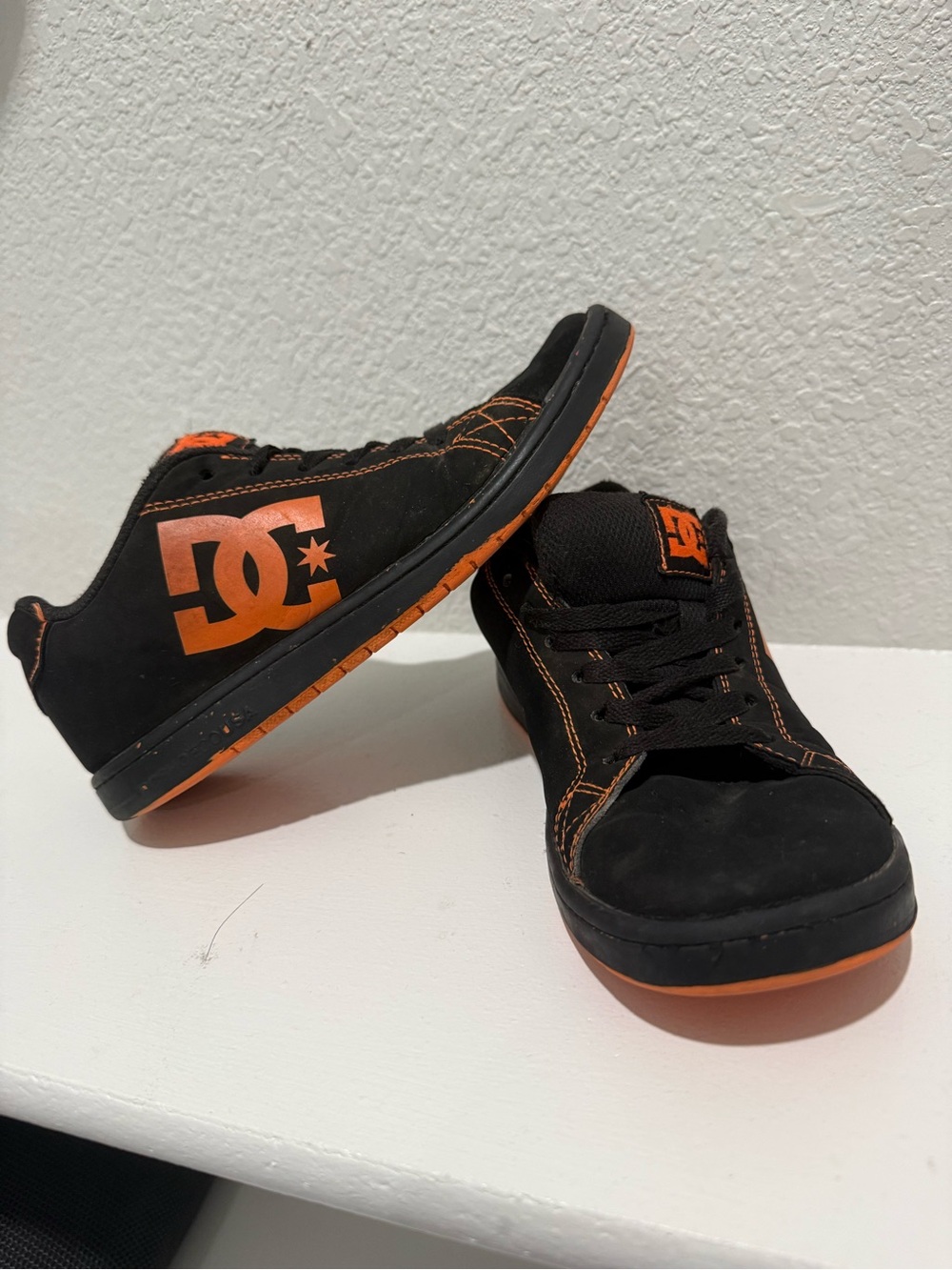 DC Black Skate Shoes with Orange Accents